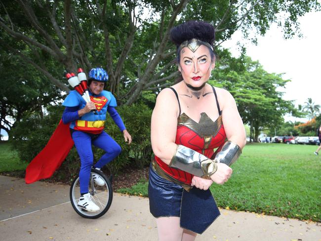 Local identities Flip Ripley and Kelly Moran participated in the Cairns Regional Council's New Year's Eve superhero fun run riding a unicycle on the Cairns Esplanade. Picture: Brendan Radke