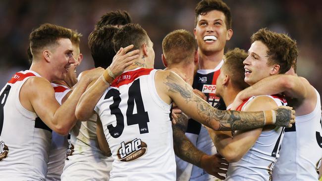 Jack Billings is mobbed by teammates after a late goal in St Kilda’s victory over Melbourne. Picture: Michael Dodge/Getty Images. 