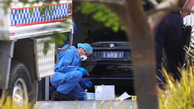 Police at the murder scene in Pimpama where Shane Bowden was gunned down in his BMW, parked in his garage. Picture: Glenn Hampson