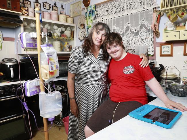 Josh Mitchell, 19, poses with his mother Toni in Rockville, Toowomba. Picture: AAP/Claudia Baxter