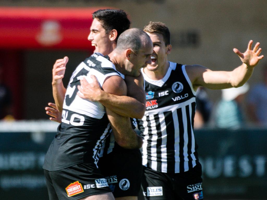 Matthew Broadbent hugs teammate Joel Garner after scoring a goal during the SANFL Port Adelaide versus North Adelaide at Alberton Oval on Sunday, April 14, 2019. (AAP Image/ Morgan Sette)