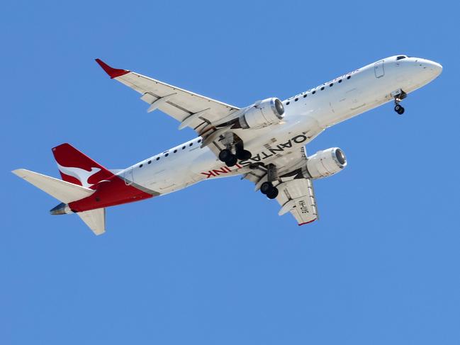 BRISBANE, AUSTRALIA - NewsWire Photos SEPTEMBER 30, 2024: A Qantas plane prepares to land in Brisbane. Hundreds of Qantas workers went on strike today demanding higher wages. Picture: NewsWire/Tertius Pickard