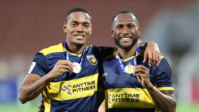 On the right, Central Coast Mariners' Ni-Vanuatu defender Brian Kaltak is a popular sporting figure in the Solomon Islands. Picture: Haitham Al-Shukairi/AFP