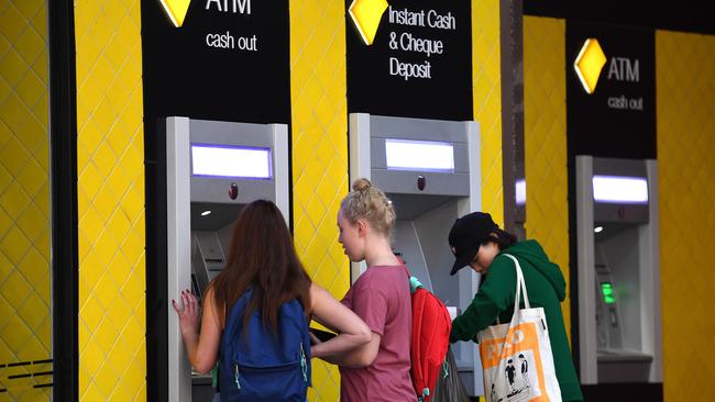 Customers use a Commonwealth Bank ATM in Brisbane. The Commonwealth Bank has been accused of a systemic failure to comply with anti-money laundering and counter-terrorism financing laws. Picture: Dan Peled/AAP