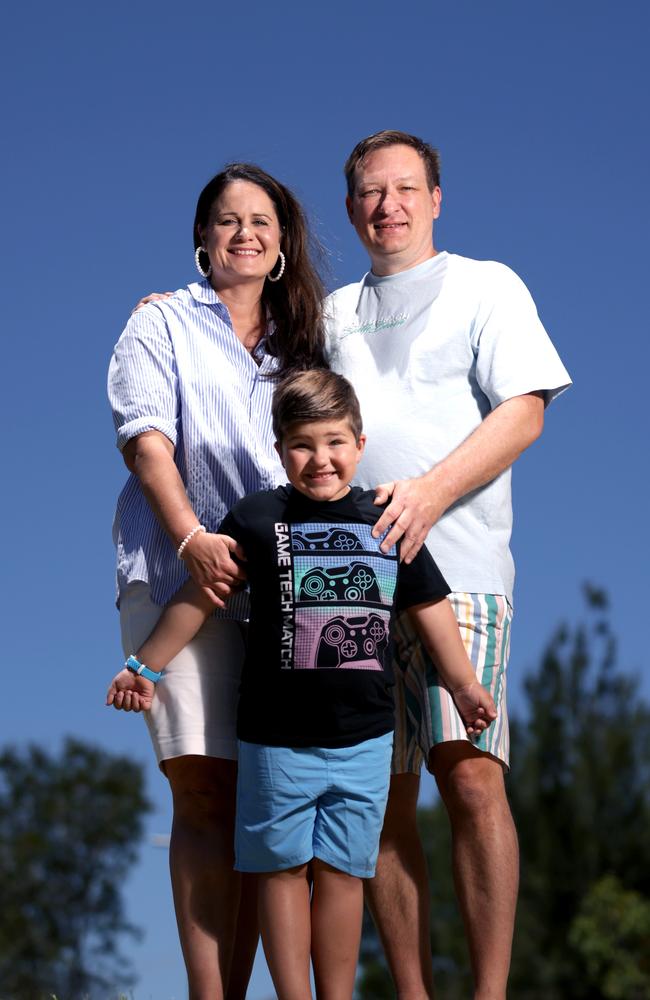 Mischa King (right), with wife Kelli Harvey and their son Ethan, 5, have safely returned their Ipswich home. Picture: Steve Pohlner