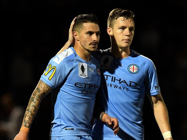 Jamie Maclaren of Melbourne City (left) is congratulated by teammate Scott Galloway after scoring a goal during the FFA Cup semi-final match between the Brisbane Strikers and Melbourne City FC at Perry Park in Brisbane, Tuesday, October 1, 2019. (AAP Image/Dan Peled) NO ARCHIVING, EDITORIAL USE ONLY