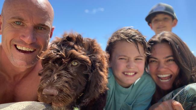 Ryan 'Fitzy' Fitzgerald with new pup Beastie and sons Hewston and Lennox and wife Belinda at the beach.