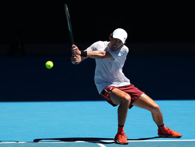 Alex de Minaur plays a backhand during a training session ahead of the 2024 Australian Open. Picture: Getty Images