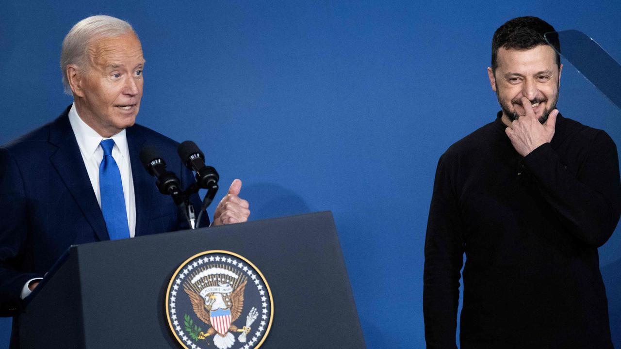 Ukraine's President Volodymyr Zelensky (R) reacts after being introduced as Russia's President Vladimir Putin by US President Joe Biden. Picture: AFP