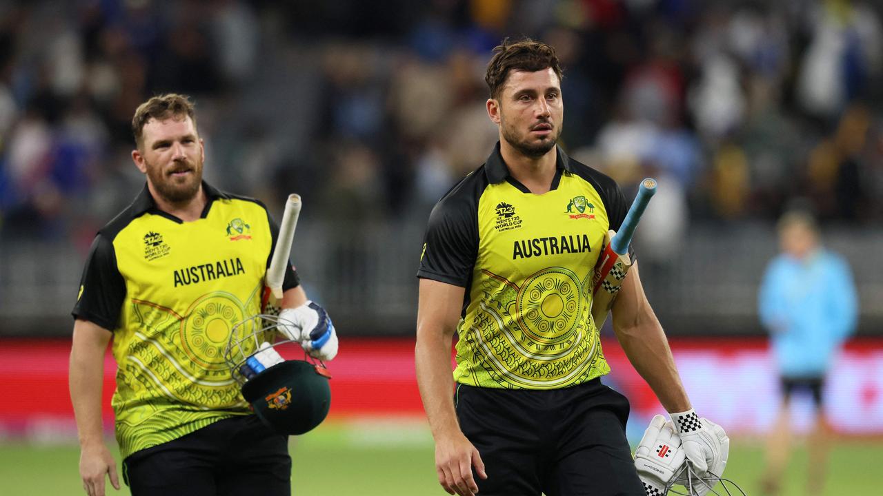 Australia's Aaron Finch (L) and Marcus Stoinis walk off the field after their win at Perth Stadium on October 25, 2022. Photo: AFP