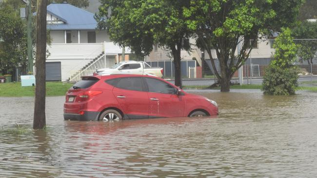 Cars parked at Marie Mackney Courts on Ballina Rd in Lismore are inundated by flood water for the second time in four weeks Picture: Nicholas Rupolo