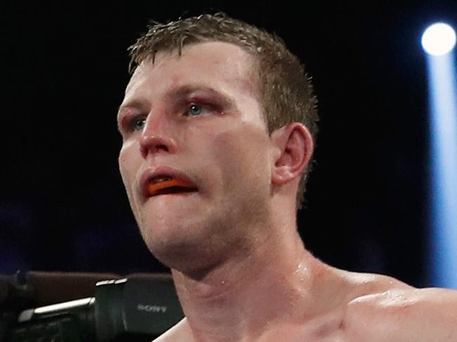 LAS VEGAS, NV - JUNE 09: Referee Robert Byrd (L) gives a count to Jeff Horn after he was knocked down by Terence Crawford in the ninth round of their WBO welterweight title fight at MGM Grand Garden Arena on June 9, 2018 in Las Vegas, Nevada. Crawford won by TKO in the ninth round.   Steve Marcus/Getty Images/AFP == FOR NEWSPAPERS, INTERNET, TELCOS & TELEVISION USE ONLY ==