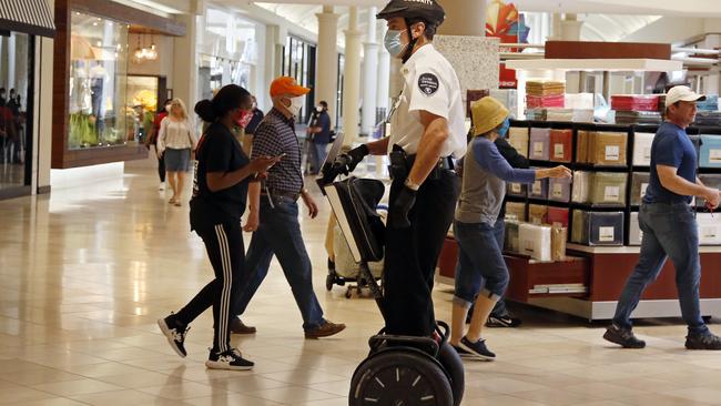 A security guard rides a Segway inside a US mall. Picture: AP