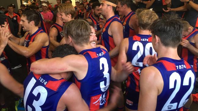 Jubilant Port Melbourne players after their victory over Box Hill Hawks.