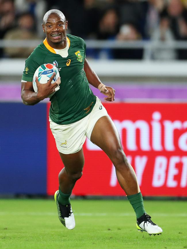 Makazole Mapimpi of South Africa breaks through to score his team's first try. Picture: Getty Images