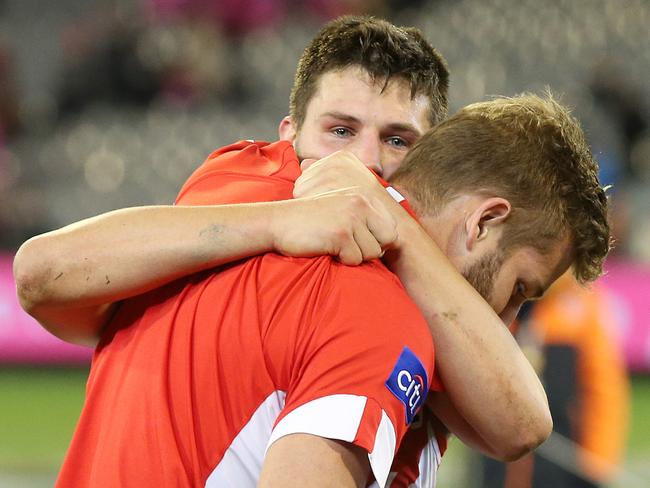 Johnson gets a hug from teammate Nic Newman after the match. Pic: Michael Klein