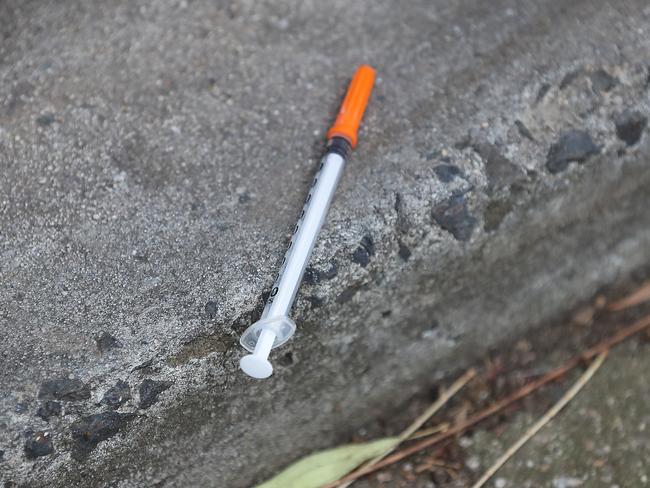 HOLD FOR THE HERALD SUN PIC DESK-----Bloodied syringes, soiled clothing and violent fights are daily realities faced by terrified residents of a housing estate at the epicentre of the MelbourneÕs illicit drug trade. Disturbing footage obtained by the Herald Sun reveal the squalid conditions inside the North Richmond Housing Estate as families living in the building plead with the Government for help. A needle lies on the ground.    Picture: Alex Coppel.