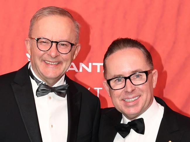 SYDNEY, AUSTRALIA - MARCH 31: Australian Prime Minister Anthony Albanese (L) stands with Qantas CEO Alan Joyce as they attend the Qantas 100th Gala Dinner at Jetbase 96 hangar at Sydney's International Airport on March 31, 2023 in Sydney, Australia. (Photo by James D. Morgan/Getty Images)