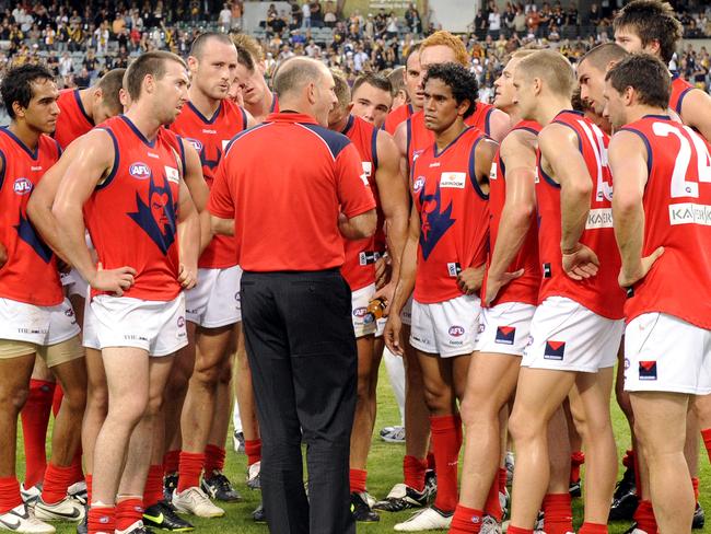 Dean Bailey addresses his Melbourne players on the field after a loss. Picture: Jackson Flindell