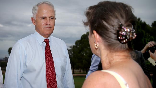 Prime Minister Malcolm Turnbull listens to Raylene Mullins, the wife of a steelworker, during his press conference at Whyalla. Pic: Mike Burton