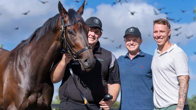 Mr Brightside with Co Trainer Ben Hayes,  Western Bulldogs footballer, James Harmes, and Strapper Will Evans at Lindsay Park Stables on Flemington Racecourse on March 15, 2024 in Flemington, Australia. (Photo by Jay Town/Racing Photos via Getty Images)