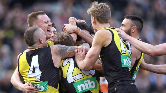 Marlion Pickett is mobbed by Richmond teammates after kicking his first AFL goal. Picture: Phil Hillyard