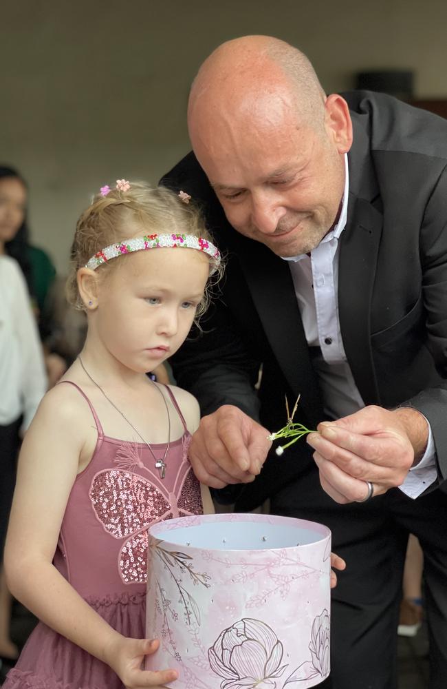 Brooklyn Fairfield (5) and Mick Fairfield release butterflies at the memorial of slain mother, Sheena Fairfield in Leanyer. Picture: (A)manda Parkinson