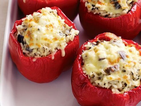 Cheesy risotto-stuffed capsicums.