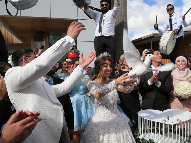 The bride and groom set doves free as part of their lavish wedding. Picture: Toby Zerna