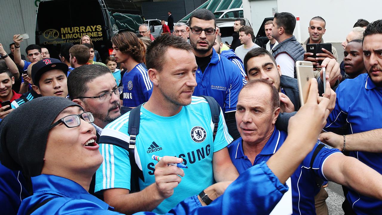 Chelsea FC captain John Terry being helped by security on the way to the team bus. Chelsea FC are in town to play Sydney FC . Picture Craig Greenhill