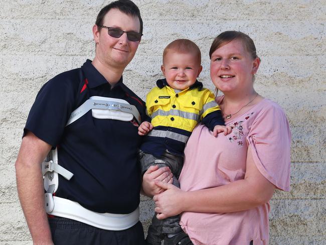 Injured volunteer firefighter James Lusted, of New Norfolk fire brigade, with partner Tiffany Smith and their son Jackson. Picture: NIKKI DAVIS-JONES