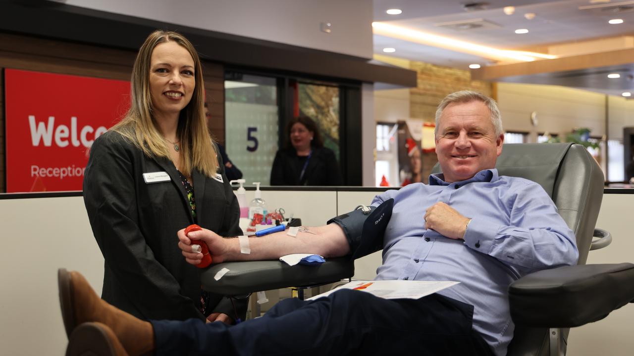 Premier Jeremy Rockliff donates blood while chatting to Leanne Mangano, Lifeblood’s group account manager. Picture: Supplied