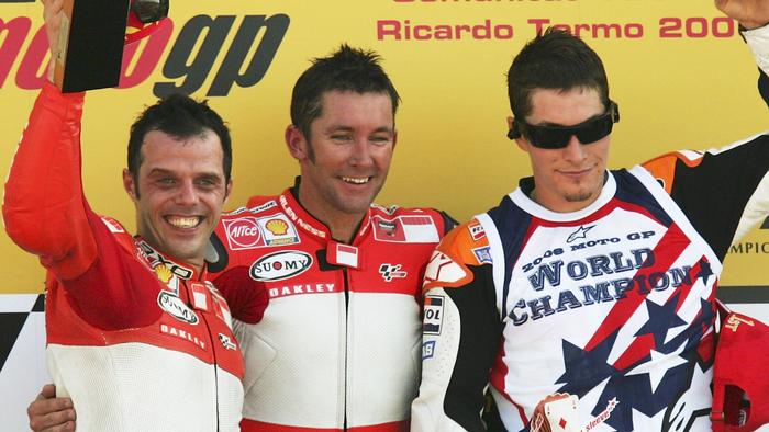 VALENCIA, SPAIN - OCTOBER 29: Troy Bayliss (C) of Australia celebrates on the podium with Loris Capirossi (L) of Italy and Nicky Hayden of the U.S. after they finished first, second and third respectively in the MotoGP race in the Ricardo Torma racetrack on October 29, 2006 in Valencia, Spain.  (Photo by Denis Doyle/Getty Images)