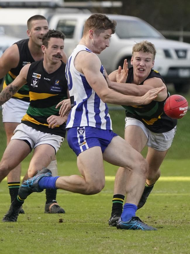 Sam VanBrummelen gets a kick away for Langwarrin. Picture: Valeriu Campan