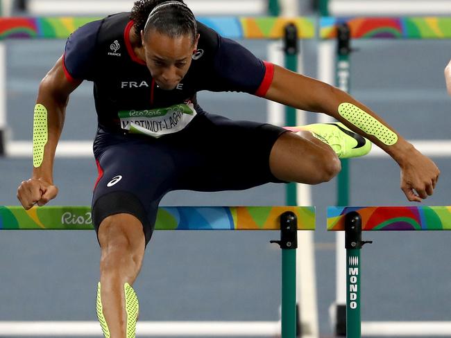 RIO DE JANEIRO, BRAZIL - AUGUST 16: Pascal Martinot-Lagarde of France and Gregor Traber of Germany compete during the Men's 110m Hurdles Semifinals on Day 11 of the Rio 2016 Olympic Games at the Olympic Stadium on August 16, 2016 in Rio de Janeiro, Brazil. (Photo by Alexander Hassenstein/Getty Images)