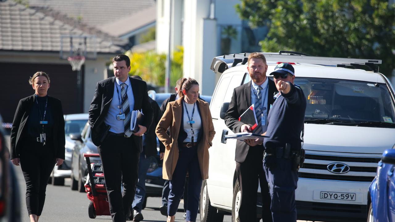 SYDNEY, AUSTRALIA - Newswire Photos - MAY 23 2023: Detectives arrive at the scene on Hertfordshire street in Elizabeth Hills in South West Sydney where a man has been shot dead as he sat in his car in the driveway of a home in a suspected gangland shootings. Picture: Gaye Gerard