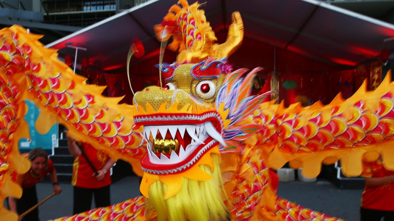 The CADCAI dragon dancers perform at the Cairns and District Chinese Association Inc Chinese New Year street festival on Grafton Street. PICTURE: BRENDAN RADKE