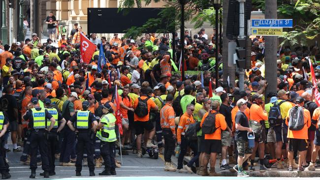 Police keep an eyee on protesters at Queens Gardens in Brisbane. Picture: Liam Kidston