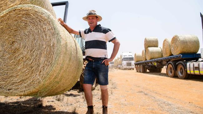 Stephen McKeough with the hay from Muslim Aid Australia. Picture: AAP Image/ Morgan Sette