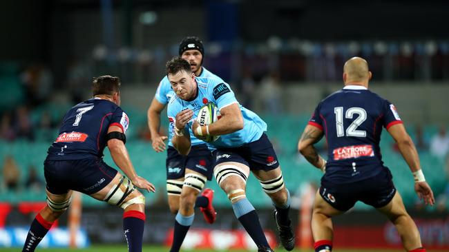 SYDNEY, AUSTRALIA - APRIL 20: Jed Holloway of the Waratahs is tackled during the round 10 Super Rugby match between the Waratahs and the Melbourne Rebels at the Sydney Cricket Ground on April 20, 2019 in Sydney, Australia. (Photo by Cameron Spencer/Getty Images)