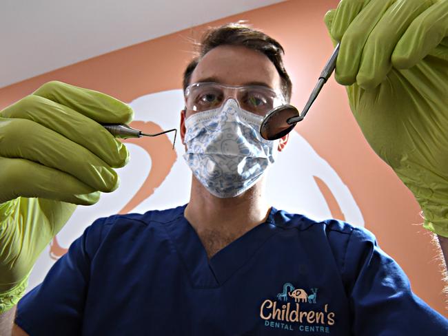 Dentist Tim Keys concerned at the number of kids needing their teeth removed.Tim is pictured working on a patient with healthy teeth.