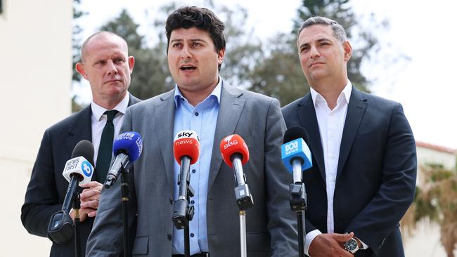 Inner West mayor Darcy Byrne, left, and Liverpool mayor Ned Mannoun flank Waverley mayor Will Nemesh, pictured speaking after Thursday’s roundtable in Bondi. Picture: John Feder