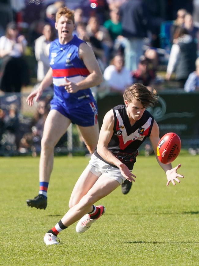 Riley McDonald gathers the ball for Devon Meadows.