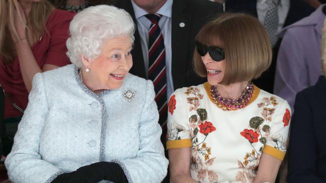 Queen Elizabeth II sits next to Anna Wintour as they view Richard Quinn's runway show before presenting him with the inaugural Queen Elizabeth II Award for British Design at London Fashion Week in 2018. Picture: Yui Mok, Getty Images