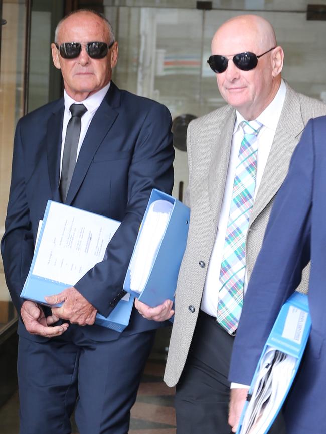 Chris Dawson leaves court with brother Peter. Picture: John Grainger