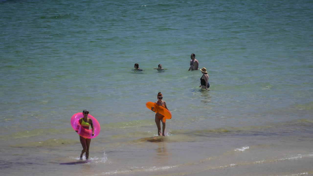 Beach goers at the popular Glenelg beach. Picture: NCA NewsWire/ Roy VanDerVegt