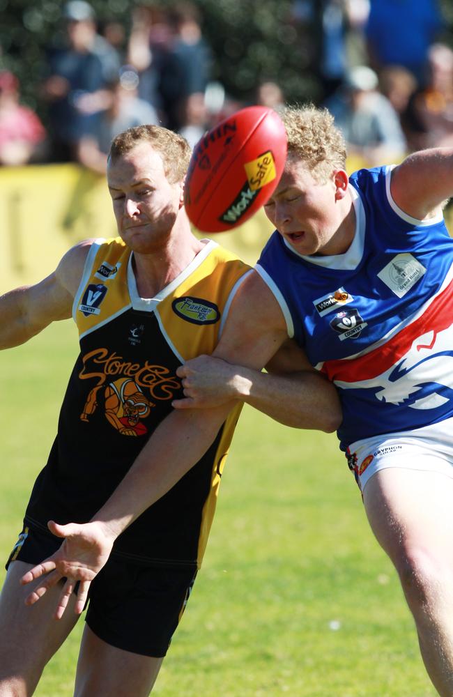 Frankston YCW’s Matt Hogan gets a quick kick away.