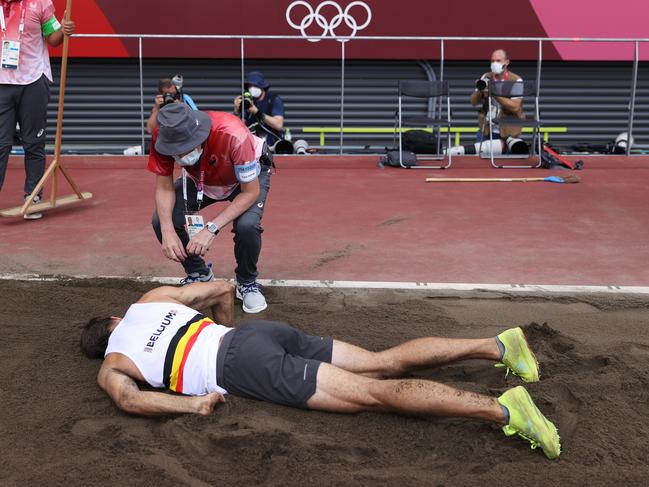 Belgian decathlete Thomas van der Plaetsen lies injured during the long jump competition. Picture: Getty Images