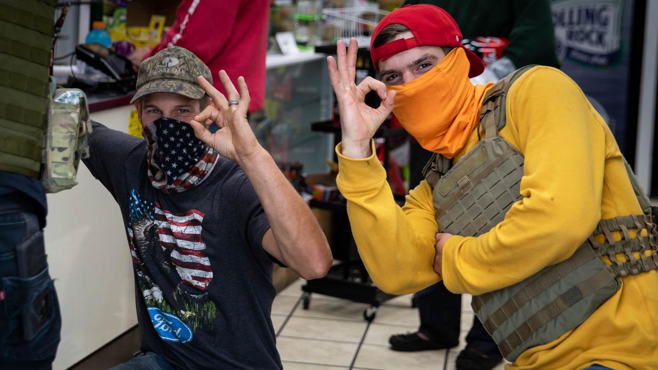 Attendees at a Proud Boys rally in Portland gesture the OK sign that is now seen as a symbol of white supremacy. Picture: Maranie R Staab/AFP