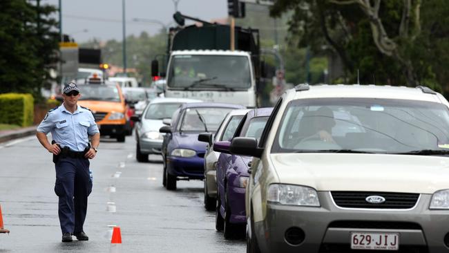 Police at scene of Omega Ruston shooting on Gold Coast Highway at Burleigh Heads.